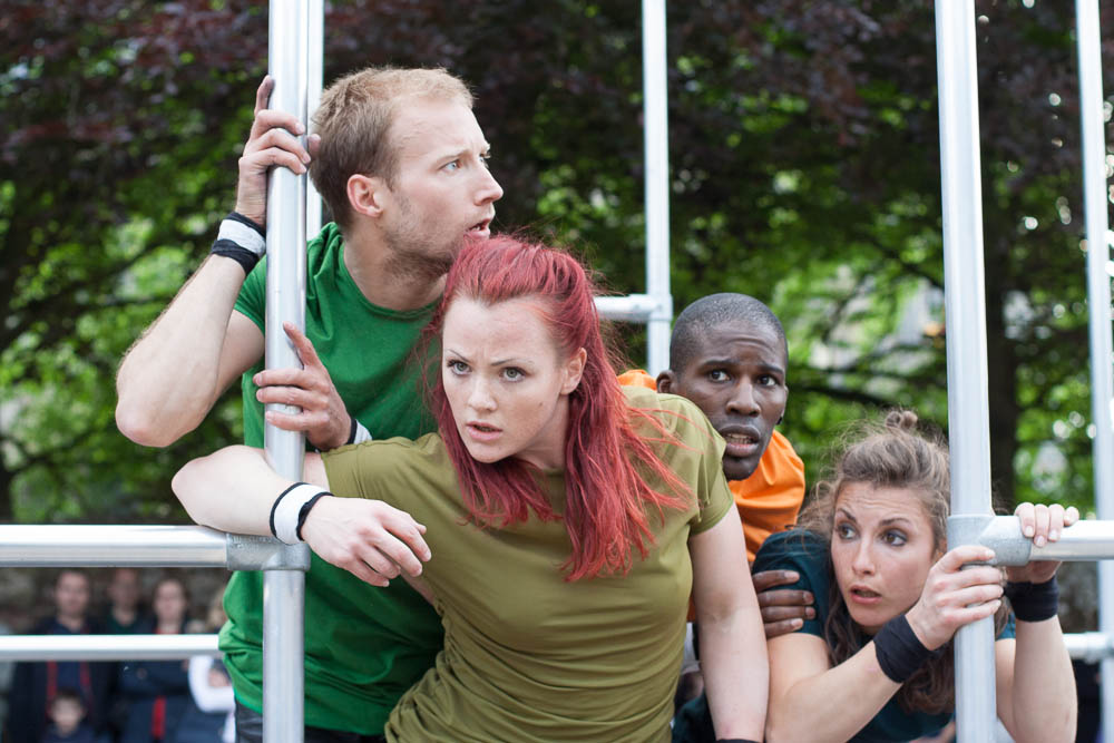 Four dancers with expressions of fear and confusion